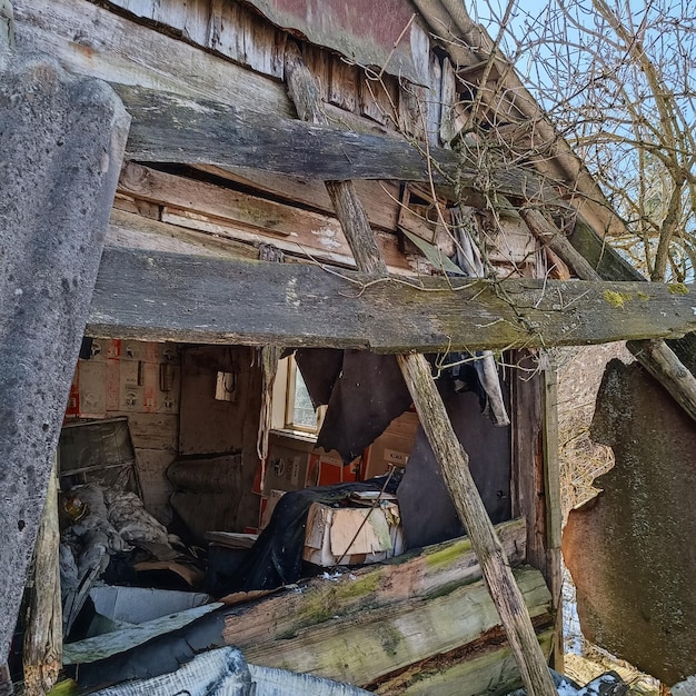 A dilapidated building with a sign on the door says'the word'on it '