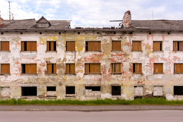 A dilapidated residential building in a ghost town Deserted street