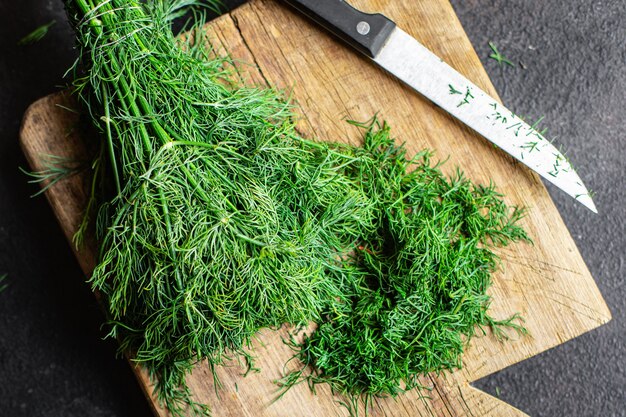 dill fresh green bunch of spicy herbs cut finely with a knife on the table healthy food meal snack