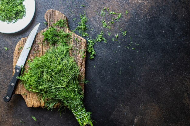 dill fresh green herb cut finely a knife on the table healthy snack copy space food background