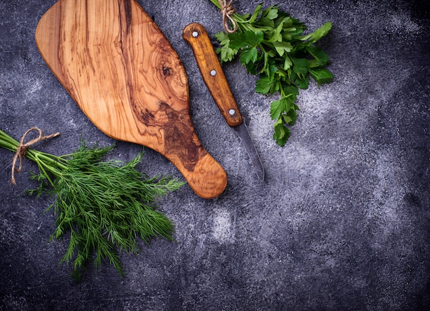 Dill, parsley and cutting board