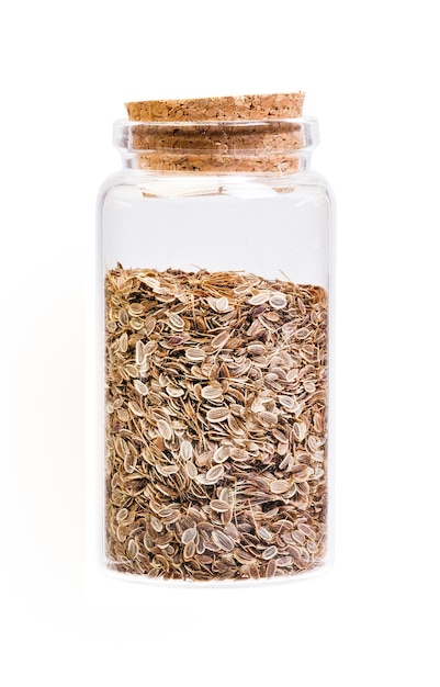 Dill seeds in a bottle with cork stopper for medical use High resolution photo