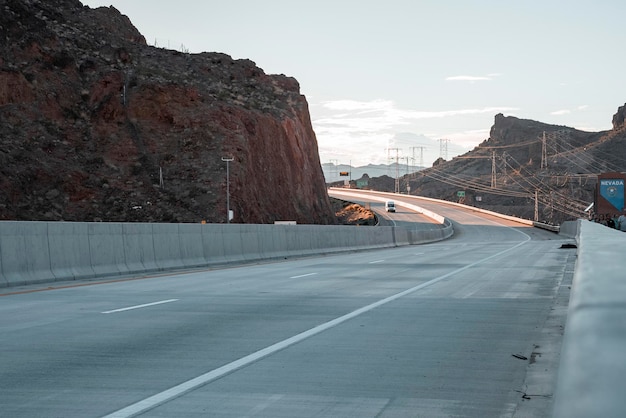 Diminishing perspective of arch bridge road at hoover dam