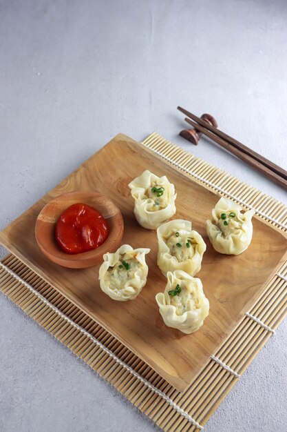 Dimsum or Steamed dumpling with sauce