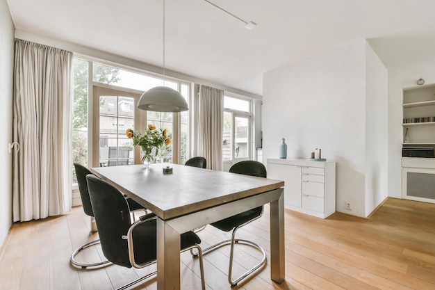 Dining area with stylish table and black chairs