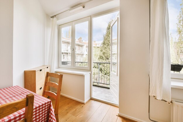 A dining room with a table and a window