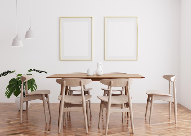 A dining room with three white frames on the wall and a wooden table with four chairs.