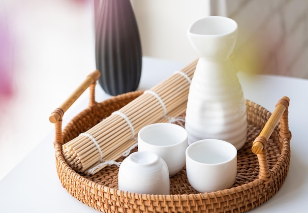 dining table in asian style with tableware and napkins