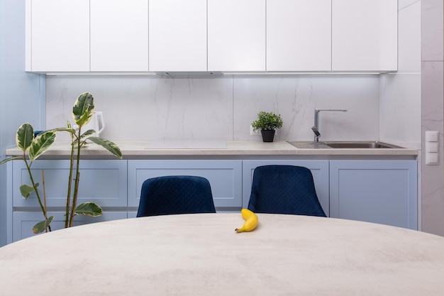 Dining table in interior of modern kitchen