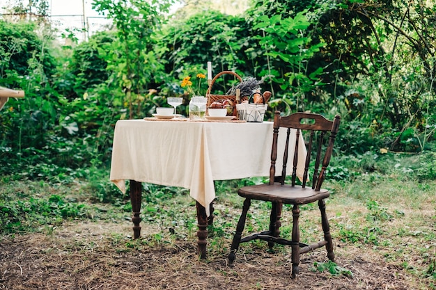 Dinner table in the backyard outdoors in countryside, nobody.