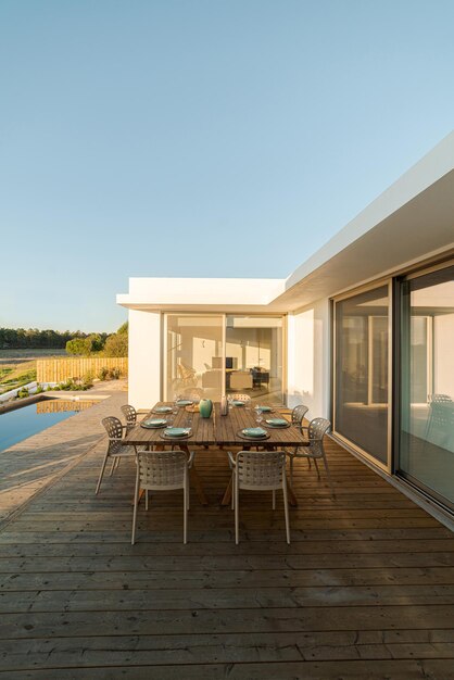 Dinner table setting in modern villa terrace