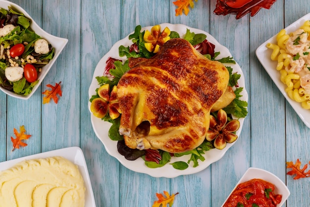 Dinner table for Thanksgiving Day. Turkey, chicken, garnish Top view