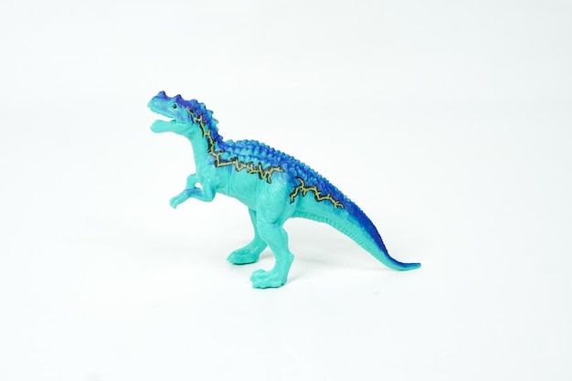 Photo dinosaur. plastic rubber toy isolated on white.