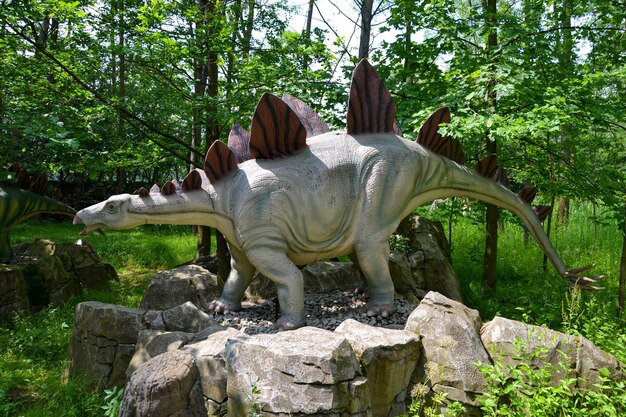 A dinosauris shown in a scene from the jurassic world dinosaur model in the park giant tyrannosaurus at an exhibition in the park