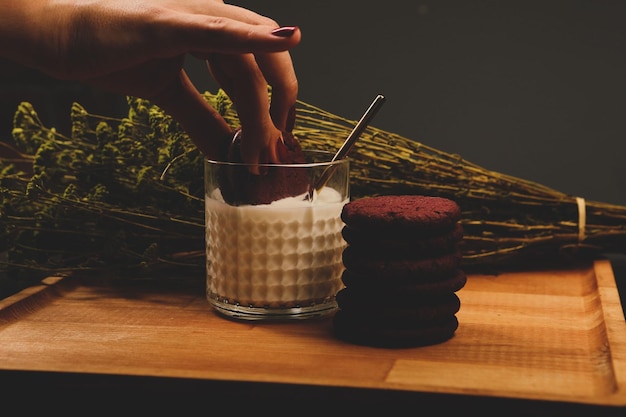 Dipping delicious cookies in a glass of milk