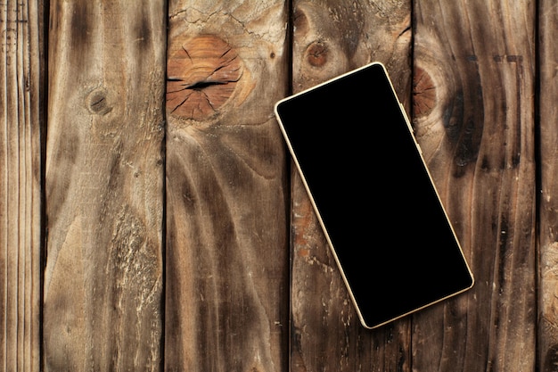 Foto direct boven uitzicht van smartphone op tafel