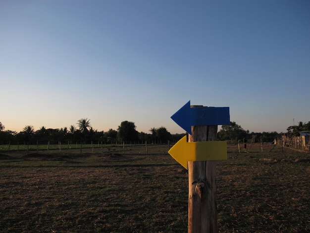 Directional arrow sign on the road of countryside in thailand