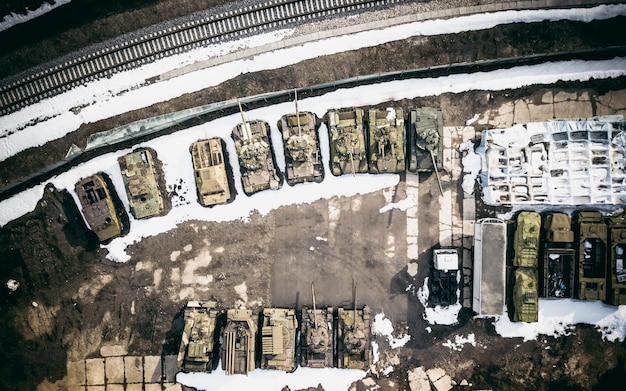 Photo directly above shot of abandoned armored tanks in snow