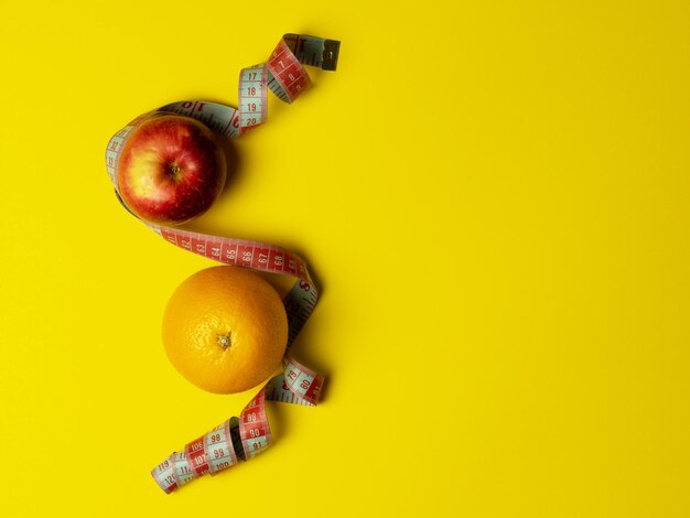 Directly above shot of apples on yellow background