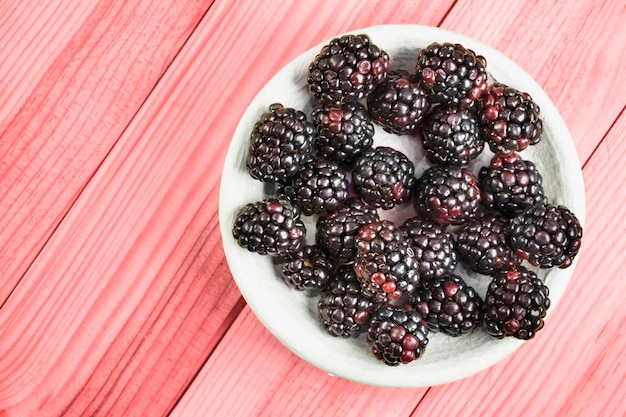 Photo directly above shot of blackberries in plate on table