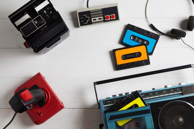 Photo directly above shot of boom box and audio cassettes on table