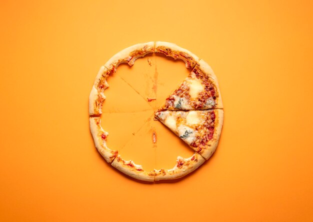 Directly above shot of bread in glass against orange background