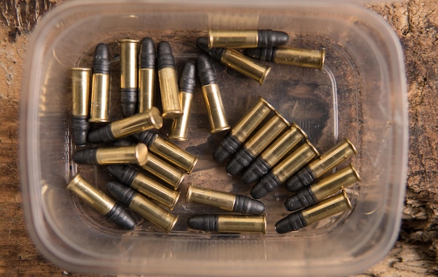 Photo directly above shot of bullets in container on table