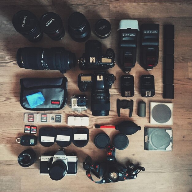 Photo directly above shot of cameras and lenses on table