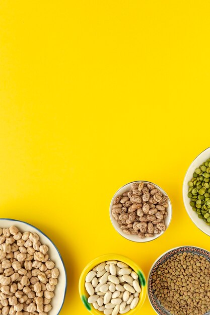 Directly above shot of candies against yellow background