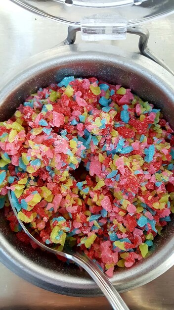 Directly above shot of candies in container on table