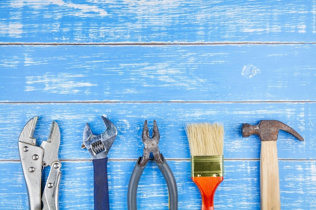 Photo directly above shot of carpentry tools on blue table