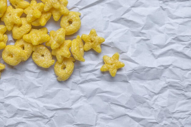 Photo directly above shot of cereals on crumpled white paper