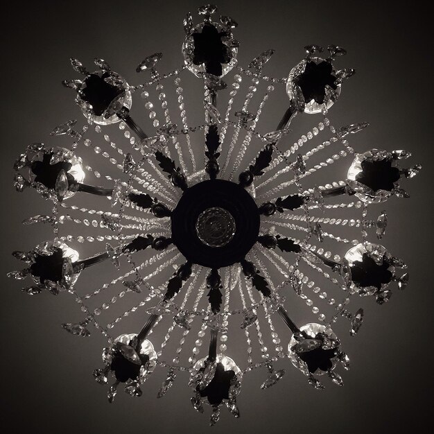 Photo directly below shot of chandelier hanging from ceiling