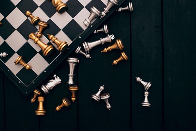 Directly above shot of chess pieces over board on table