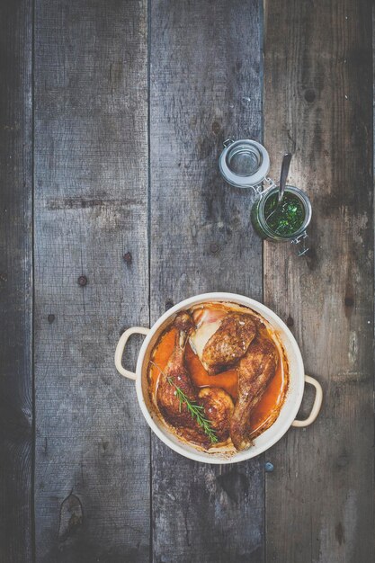 Directly above shot of chicken wings in container on table