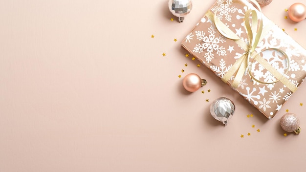 directly above shot of christmas decorations against pink background