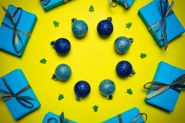 Directly above shot of christmas decorations on yellow background