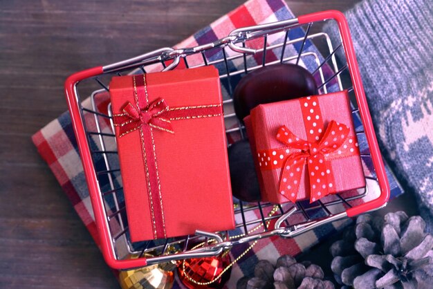 Photo directly above shot of christmas presents in shopping basket