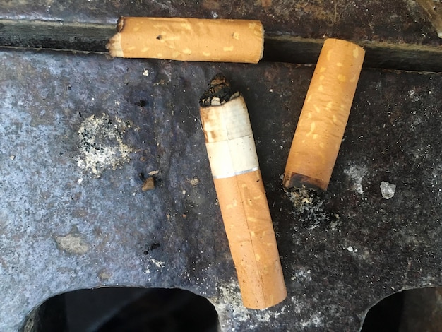 Photo directly above shot of cigarettes on metal
