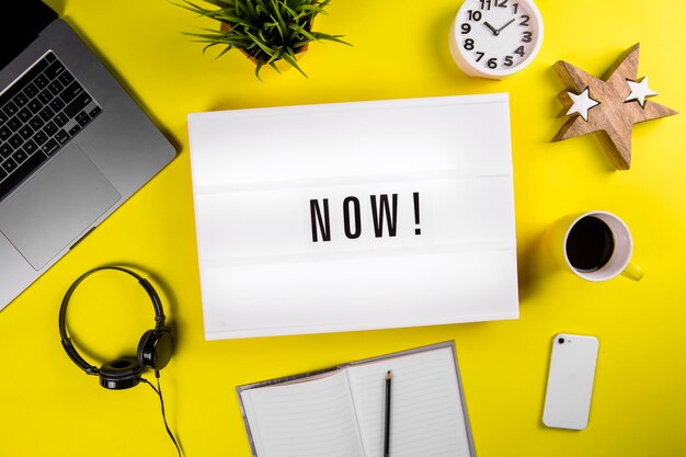 Directly above shot of clock and laptop on table