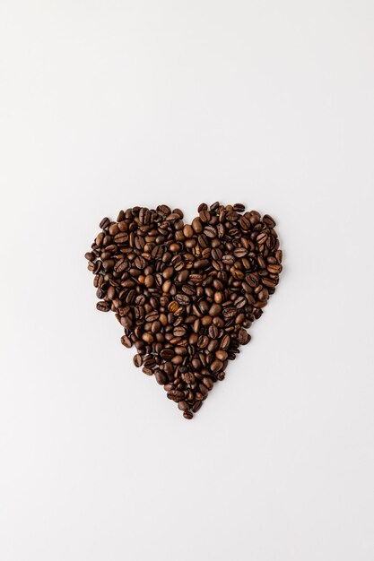 Directly above shot of coffee beans against white background