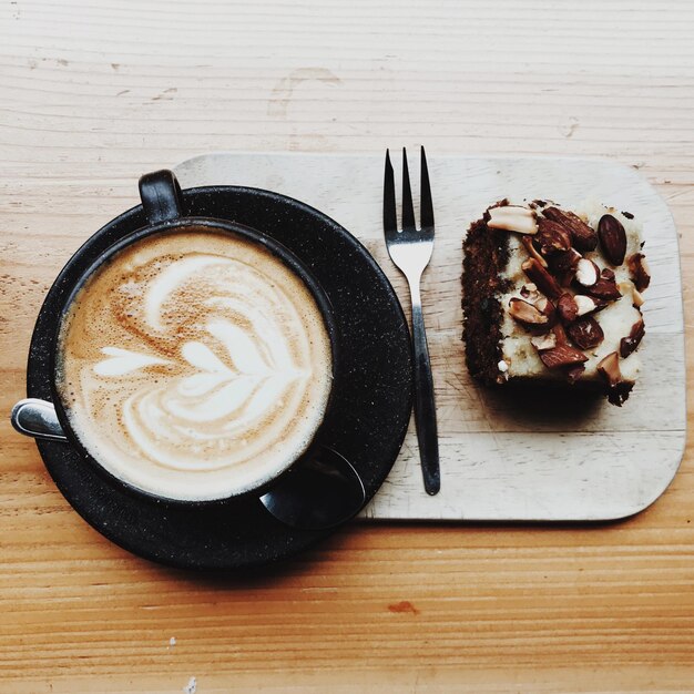 Photo directly above shot of coffee and cake on table