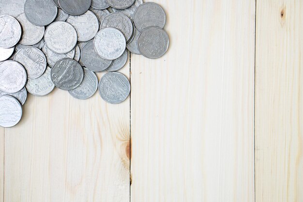 Directly above shot of coins on wooden table