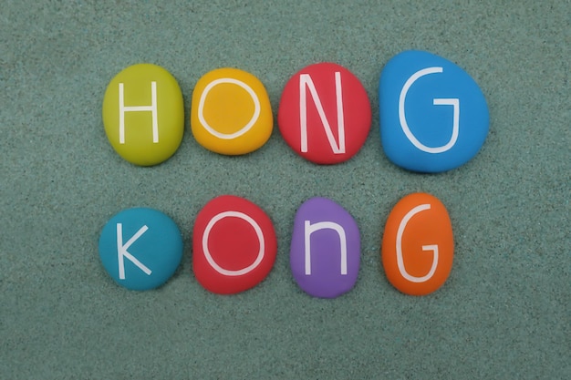 Photo directly above shot of colorful pebbles with alphabets on table