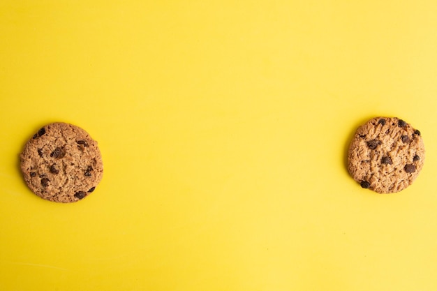 Photo directly above shot of cookies on yellow table