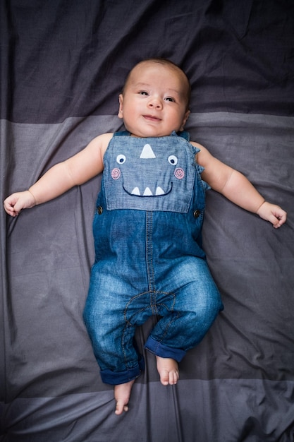 Directly above shot of cute baby girl relaxing on bed