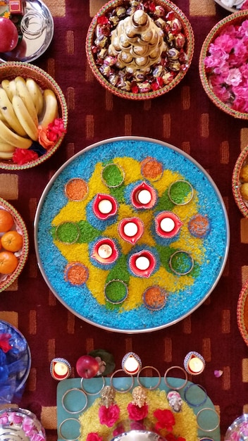 Photo directly above shot of diyas amidst various on table