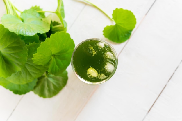 Photo directly above shot of drink with herbs on table