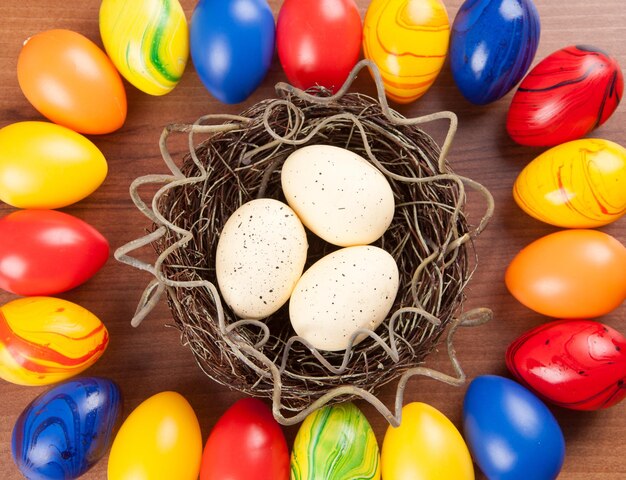 Directly above shot of easter eggs in nest on table at home