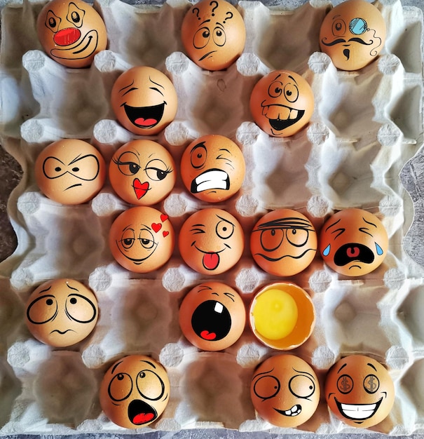 Photo directly above shot of eggs with anthropomorphic faces